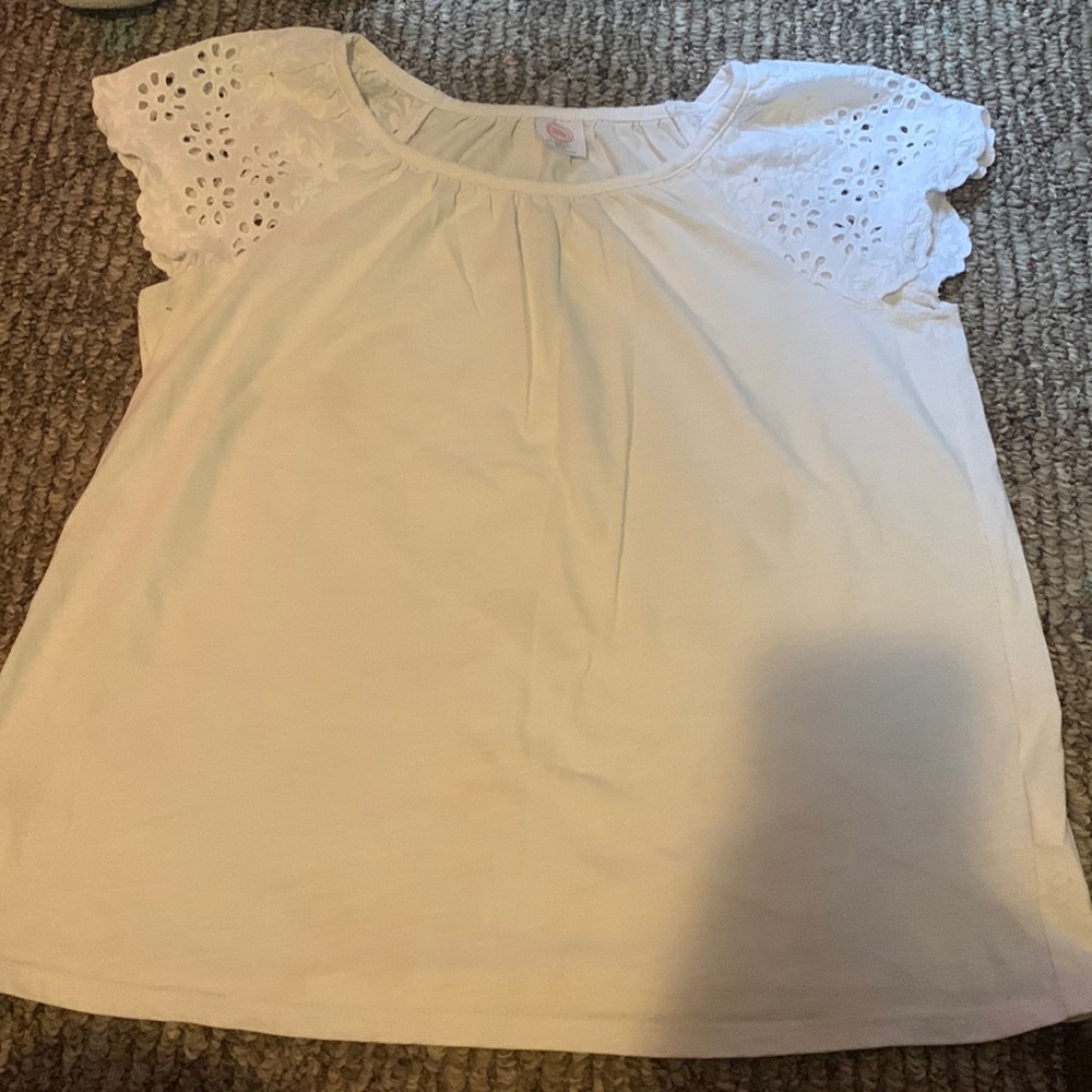 This is a dressy white blouse. It’s from wonder nation and is a large 10-12!